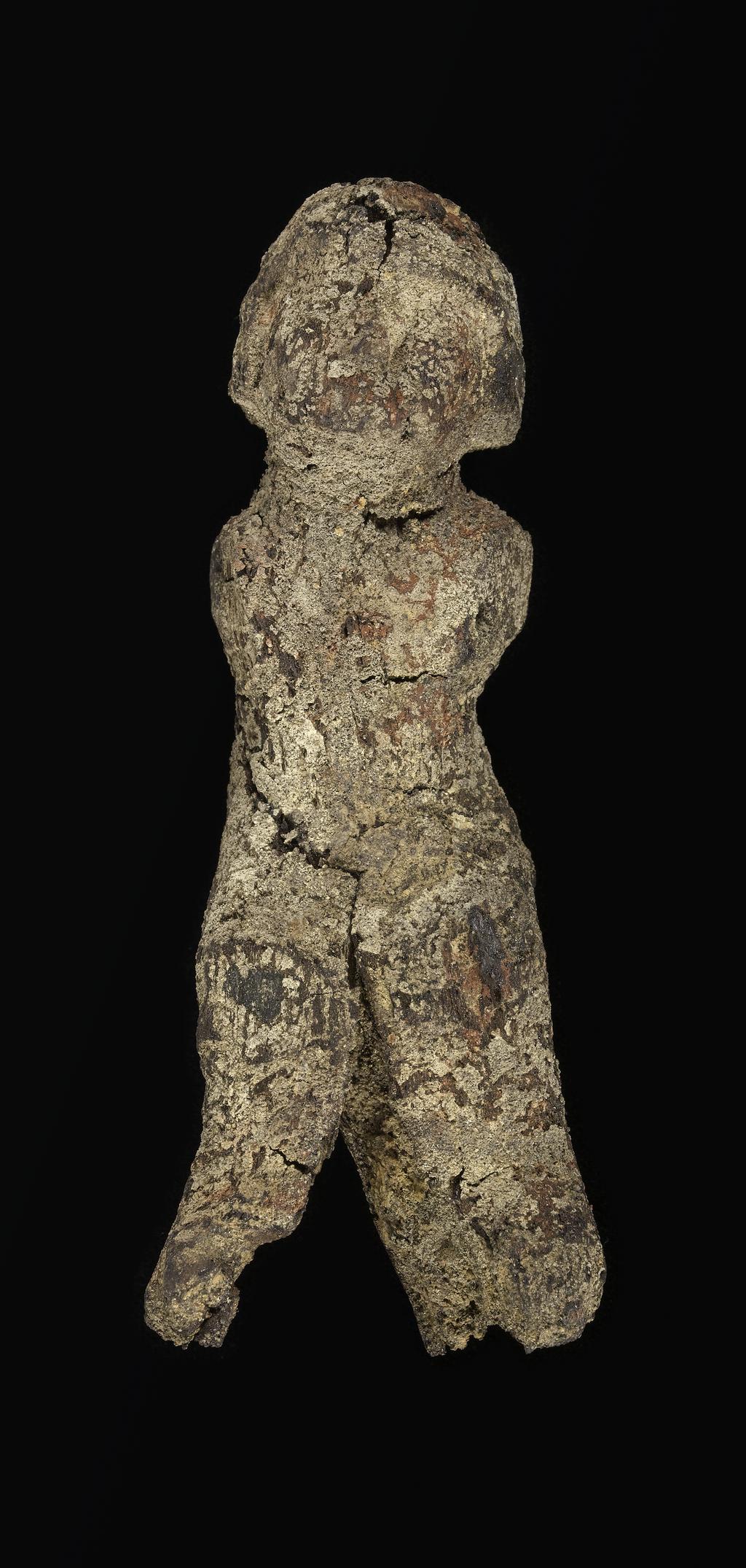 An image of Figure/statuette. Male figure, seated. Find Spot: Beni Hasan. Production Place: Egypt. Wood, height 0.125 m. Twelfth Dynasty. Middle Kingdom.