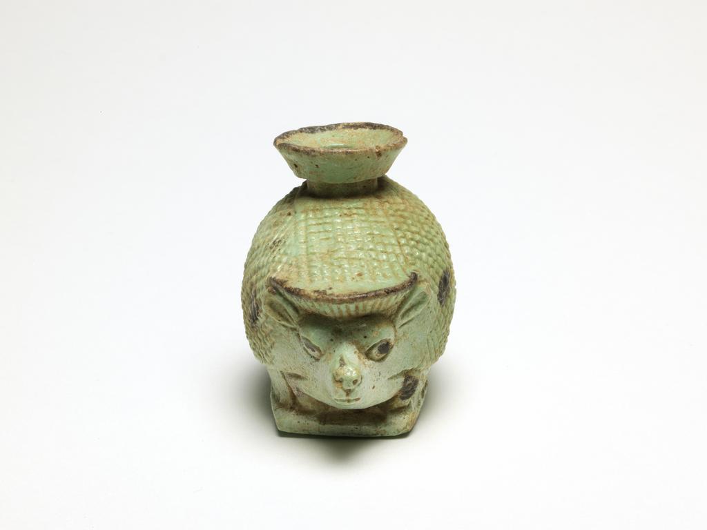 An image of Aryballos cosmetic vessel in the form of a hedgehog. Dimensions height 0.054 m, length 0.066 m, width 0.041 m.