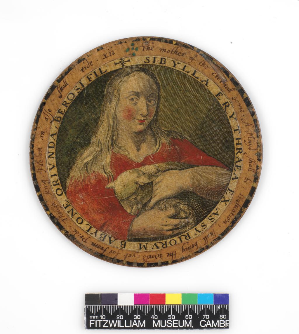An image of Roundel or trencher. One of twelve wooden roundels, with an applied print of the Erythraean Sibyl. Hand-coloured in red, green, ochre and black. Inscribed in black ink. Undecorated reverse. With a small hole near the top at the edge, diameter 13.7 cm. Part of M.5.1-13 & A-1920: Box containing twelve roundels or trenchers. Unknown maker, after Passe, Crispijn I de, printmaker (Flemish, 1564-1637). Circular box and cover of turned wood, containing twelve roundels. Each decorated with an applied hand-coloured engraving of a Sibyl, surrounded by a hand-written English inscription. Height, box, 6.7 cm, diameter, box, 17.1 cm, diameter, roundels, 13.7 cm, circa 1601 to circa 1625.