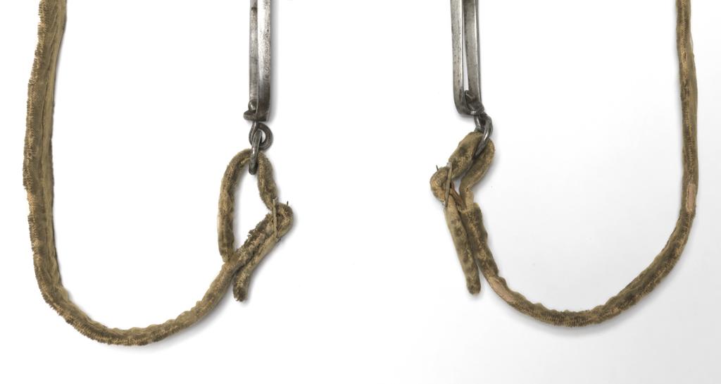 An image of Armour. Bridle component. Steel bit, with original bridle and reins covered with yellow velvet. Unknown production, Germany. Circa 1500-1550. POST-CONSERVATION.