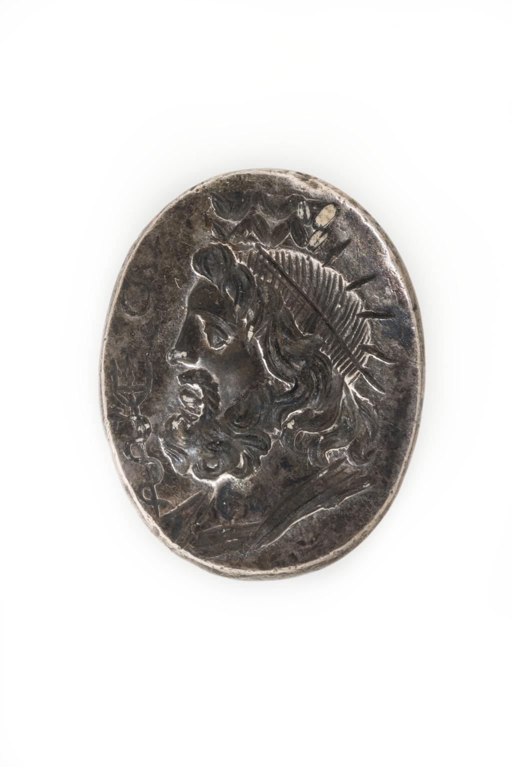 An image of Engraved gems. Magical amulet. Obverse: Serapis. Reverse: Inscription. Intaglio cutting, 101-300 AD. Roman.