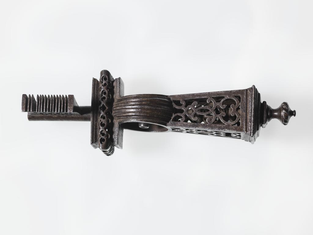 An image of Key. Iron, double-piped stem, ornately pierced, with fine comb wards, bearing the initials ‘P.F.’.  French. Circa 1600-1700.