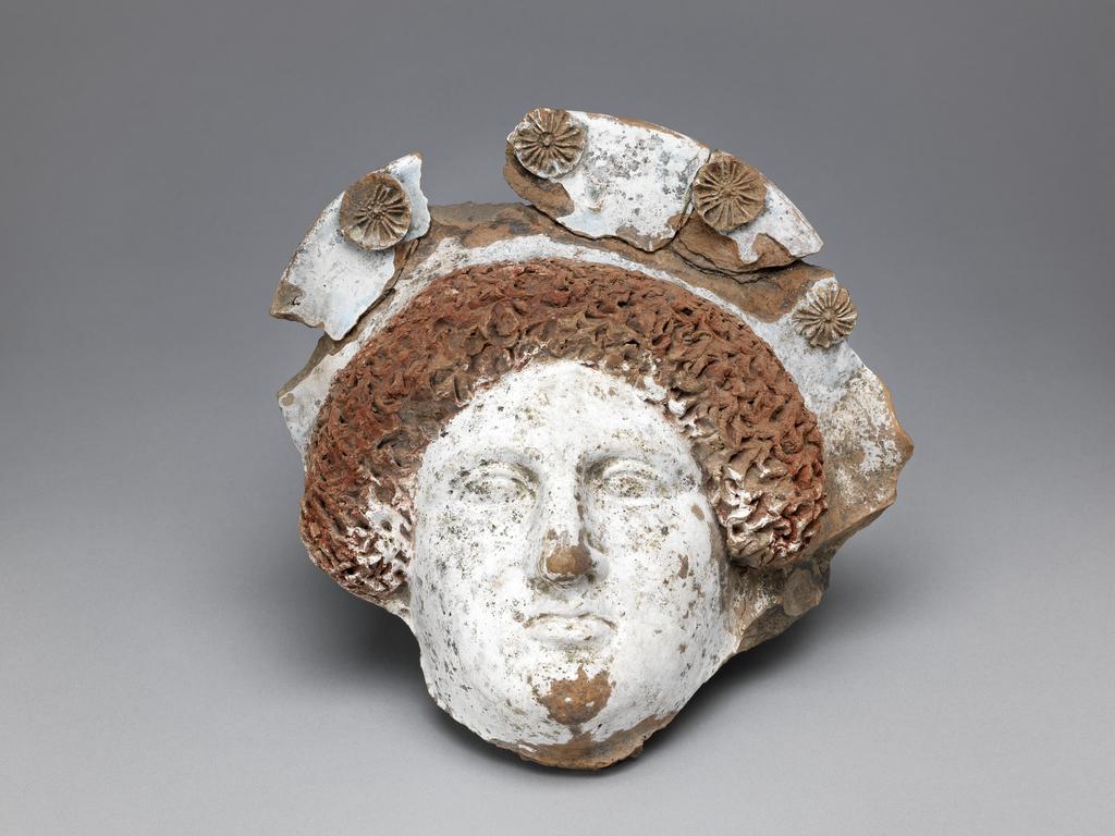 An image of Figure/Head. Head of woman. Production Place: Greece. Find Spot: Naukratis, Egypt. Clay, moulded and painted, 400-301 B.C. Classical Period. POST-CONSERVATION.