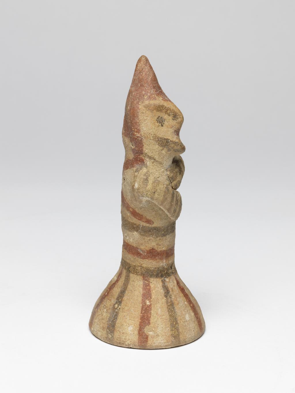 An image of Figure/statuette. Bichrome ware. Worshipper. Production Place: Cyprus. Clay, height 0.138 m, 700 B.C. Cypro-archaic/Archaic period.