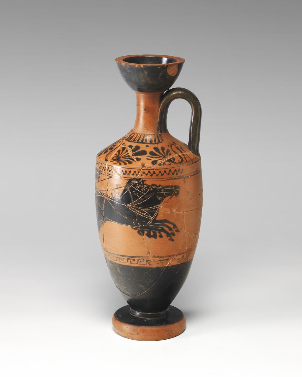 An image of Vessel. Lekythos. Chariot-race. Production Place: Attica, Athens. Clay, black-figured, height 0.315 m, width 0.126 m, 500-490 B.C. Archaic Period.