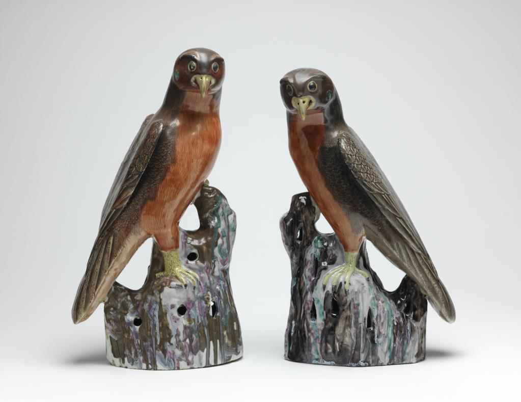 An image of Hawk. Animal Figure. One of a pair, Red and brown, on a pierced rock or branch. Hard-paste porcelain, height 35.1 cm, 1725-1775. Chinese.