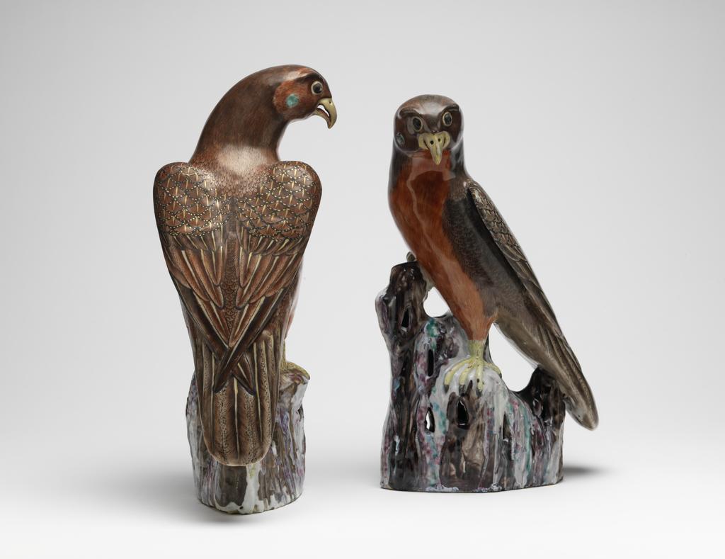 An image of Hawk. Animal Figure. One of a pair, Red and brown, on a pierced rock or branch. Hard-paste porcelain, height 35.1 cm, 1725-1775. Chinese.