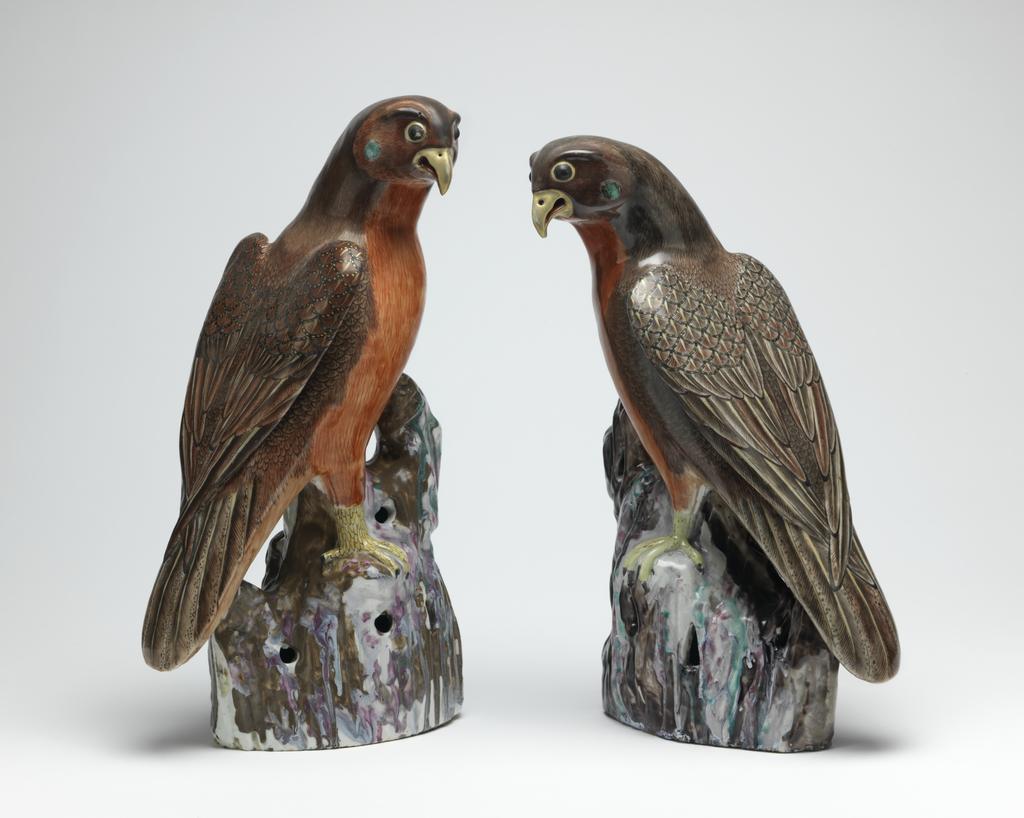 An image of Hawk. Animal Figure. One of a pair, Red and brown, on a pierced rock or branch. Hard-paste porcelain, height 35.1 cm, 1725-1775. Chinese.