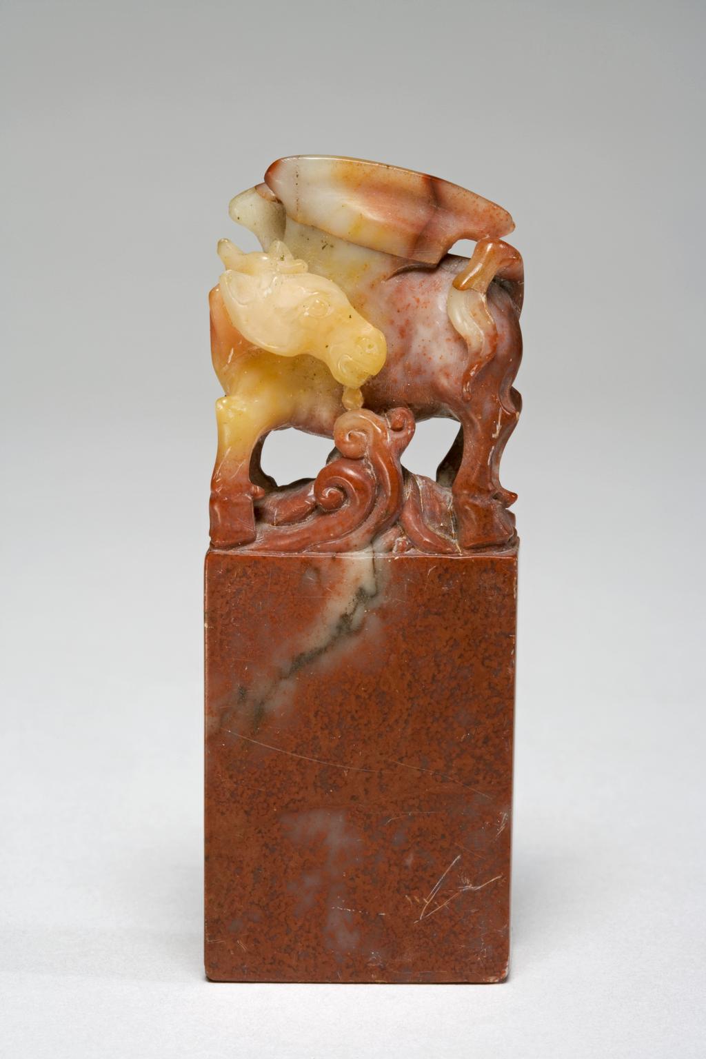 An image of Soapstone seal, with a finial in the form of a winged unicorn, carved with the characters Dan yu (pale moon). Possibly an 'art name' seal of a painter or calligrapher. Height 7 cm, width 2.7 cm, 1800-1899. Chinese.