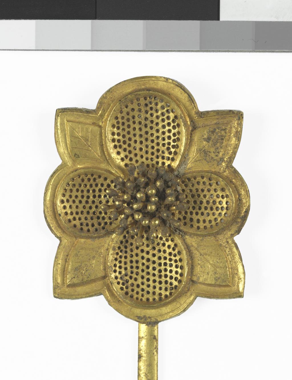 An image of Hairpin. Unknown maker, China. Gold hair pin the head in shape of a flower with four petals pierced and for engraved with veining and is soldered to a long pin. Gold, length, 21.6, cm, width, 3.8, cm, circa 907. Chinese T’ang or early Sung Dynasty.