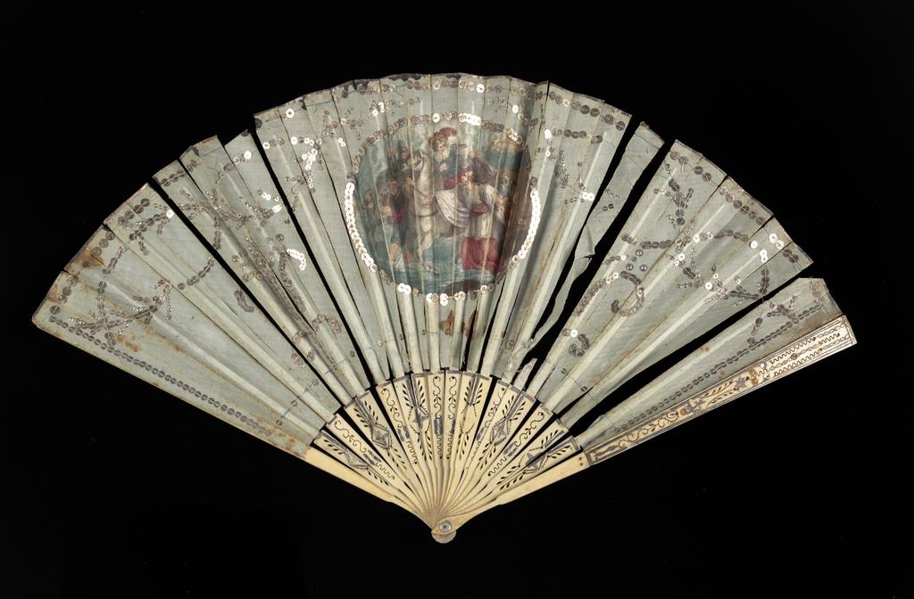 An image of Folding fan. Mary Queen of Scots, Escaping from Lochleven Castle. Unknown maker, France. Depicting the escape of Mary Queen of Scots from Lochleven Castle. Pale blue silk leaf, with a stipple printed in colour on fretted bone sticks. Circa 1785. Acquisition Credit: Accepted by H. M. Government in lieu of inheritance tax from the Lennox Boyd Estate.
