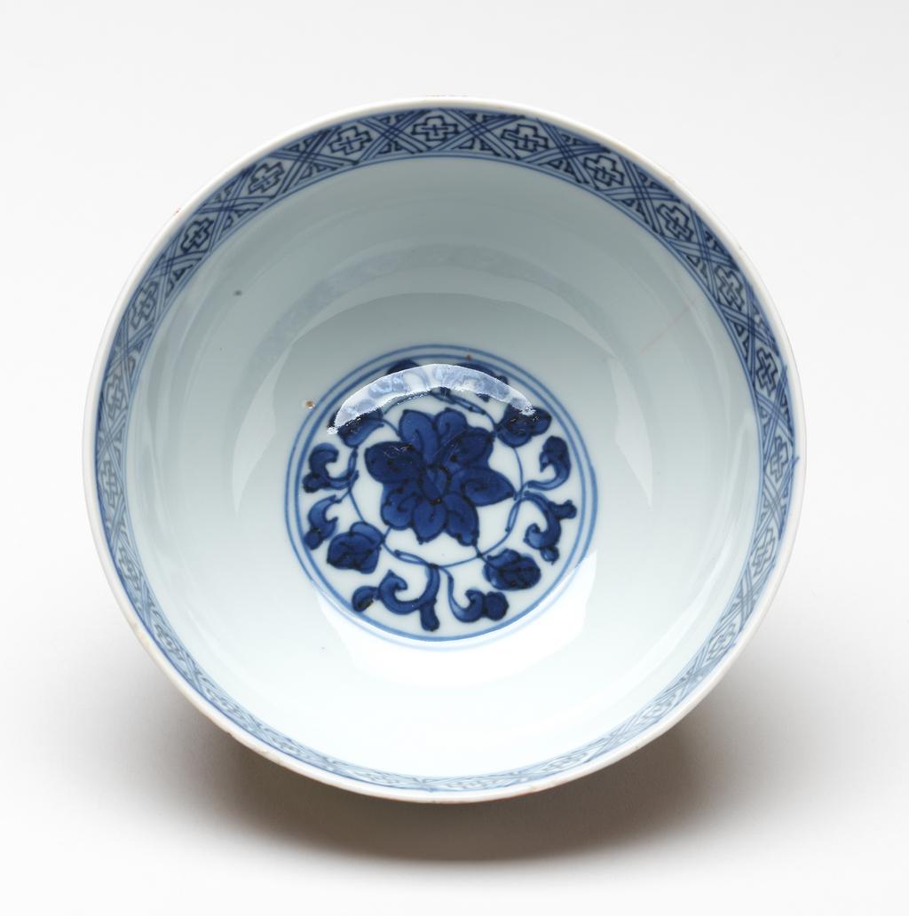 An image of Bowl. Production Place: China. A kinrande red bowl with gilt lotus, mark Fu Gui Jia Qi (lucky vessel for the rich and honourable), (crack and frits), diameter 12.1 cm. Jiajing period (1522-1566). 16th century. Notes: Kinrande (literally "gold brocade") is a Japanese porcelain style where gold is applied on the surface. There are a number of various styles. It developed from the Chinese wucai during the middle of the Ming dynasty.