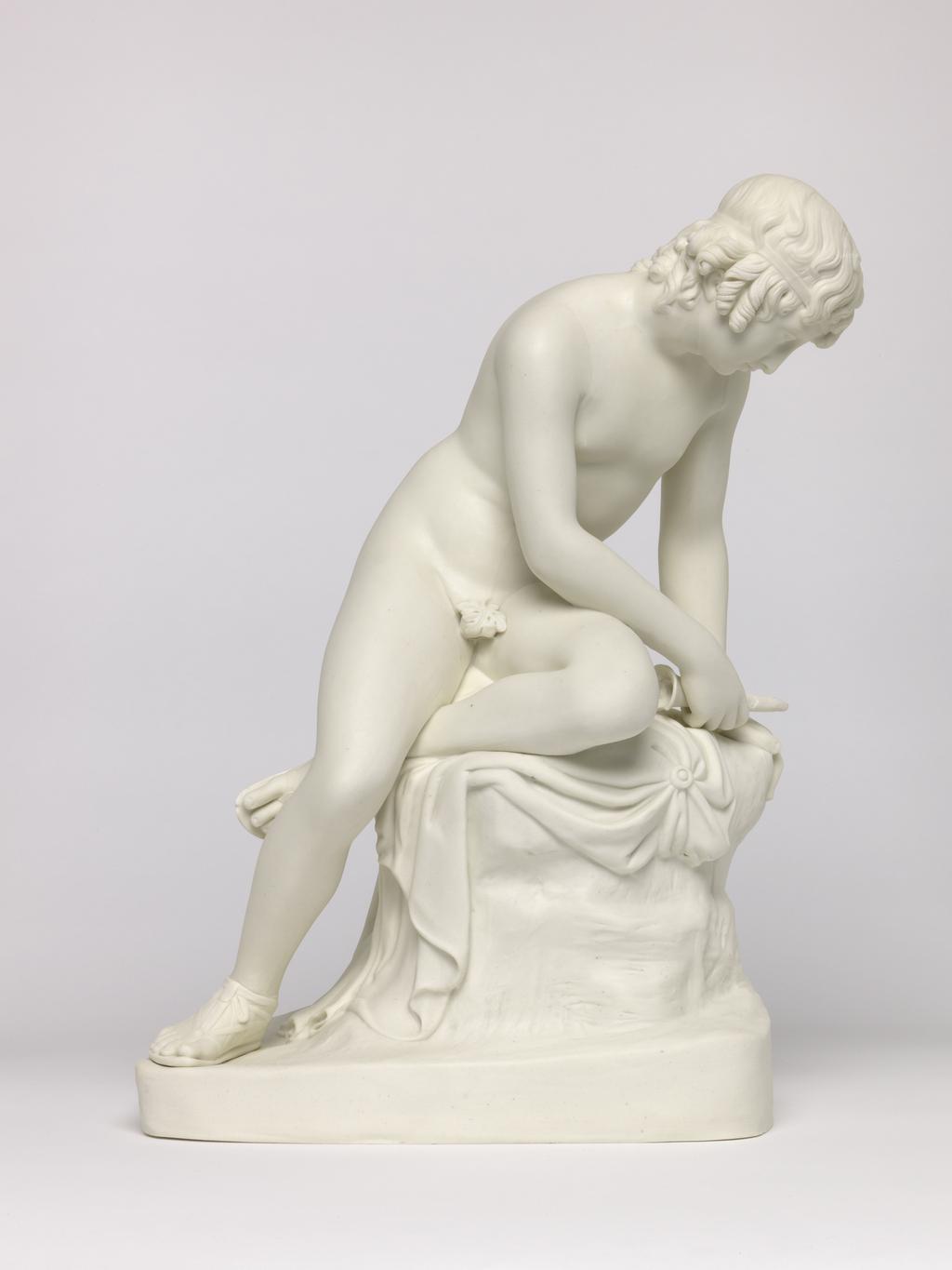 An image of Figure. Narcissus. Copeland, England, Staffordshire, Stoke-on-Trent. Stephens, E. B., modeller (British). Gibson, John, sculptor, after (British, 1790-1866). Art Union of London, distributor. Inscription: Maker's name; marked; NARCISSUS BY GIBSON R.A. modelled by EB STEPHENS and executed in STATUARY PORCELAIN BY COPELAND & GARRETT FOR THE UNION OF LONDON 1846. Parian (porcelain), slip-cast, height 30.9 cm, length 24.1 cm, width 12.8 cm, length, base, 12.8 cm, width, base, 20.9 cm, 1846. Acquisition Credit: Accepted by H. M. Government in lieu of Inheritance Tax from the estate of G. D. V. Glynn, and allocated to the Fitzwilliam Museum.