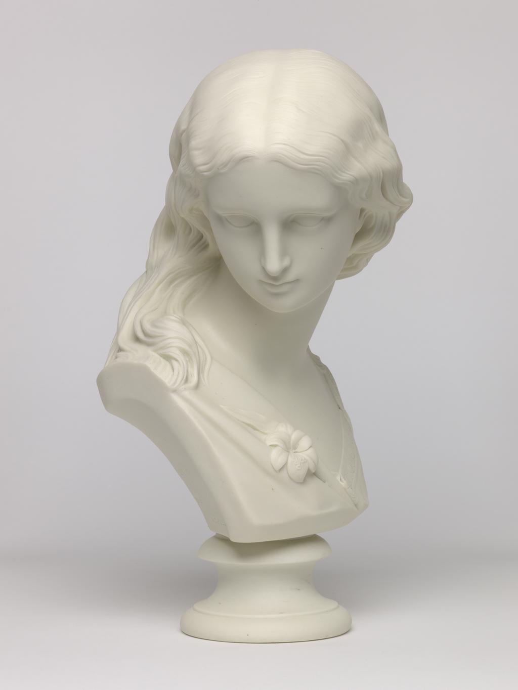 An image of Bust. Purity. Copeland, England, Staffordshire, Stoke-on-Trent. Noble, Matthew, sculptor (British, 1818-1876). Crystal Palace Art Union, distributor, England. Inscription: Maker's name; reverse of bust; marked; CERAMIC AND CRYSTAL PALACE ART UNION PUB. NOVEMBER 1869 COPYRIGHT RESERVED COPELAND L M. NOBLE SC. Parian (porcelain), slip-cast, height, 32.4 cm, length, 18.8 cm, width, 17.5 cm, length, base, 9.8 cm, 1869. Acquisition Credit: Accepted by H. M. Government in lieu of Inheritance Tax from the estate of G. D. V. Glynn, and allocated to the Fitzwilliam Museum.