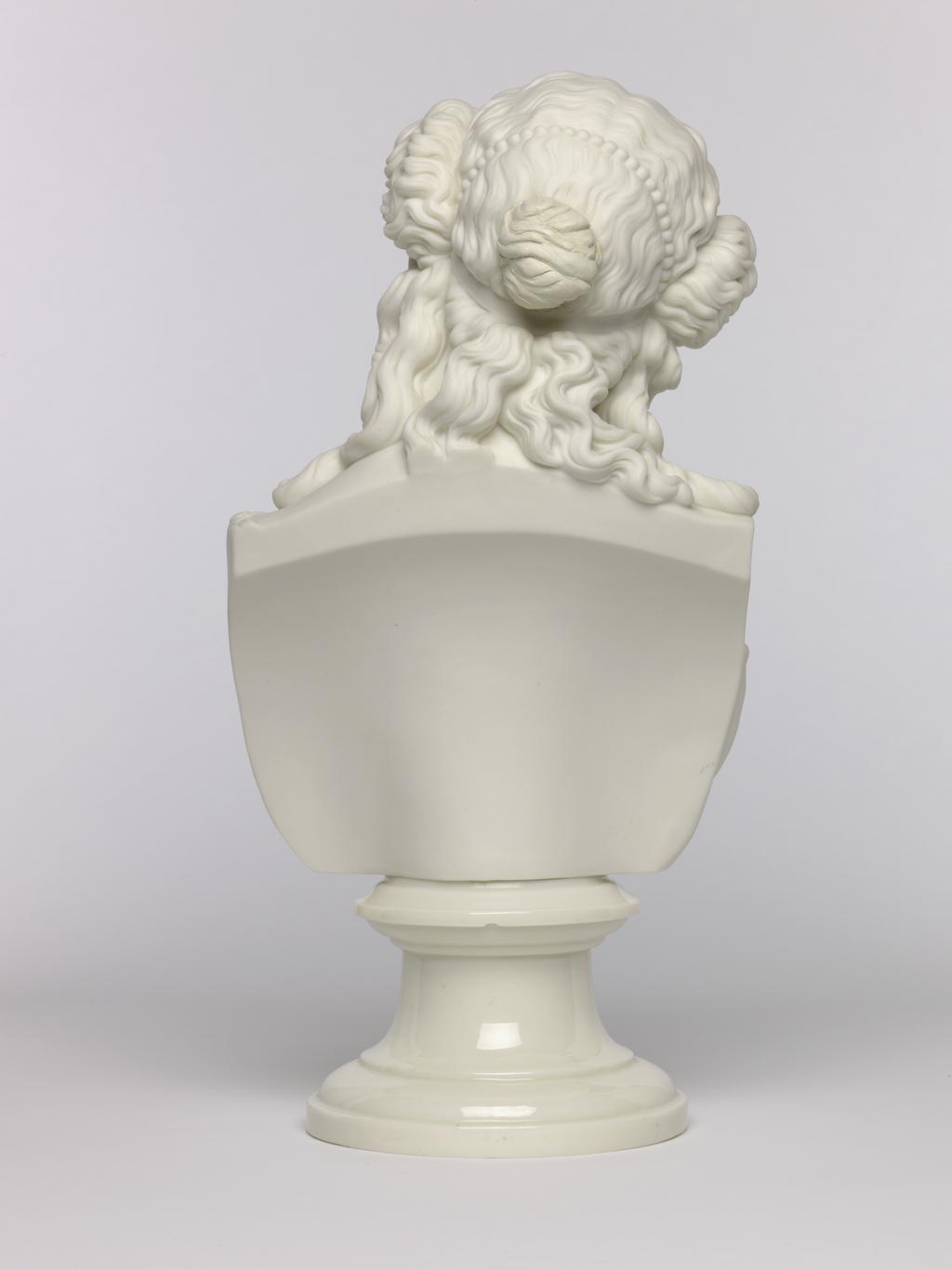 An image of Bust. Unknown lady. Unknown manufacturer. Parian (porcelain), slip-cast, with glazed socle, height, 33.8, cm, length, 16.5 cm, width, 13.9 cm, length, base, 12.2 cm. Acquisition Credit: Accepted by H. M. Government in lieu of Inheritance Tax from the estate of G. D. V. Glynn, and allocated to the Fitzwilliam Museum.
