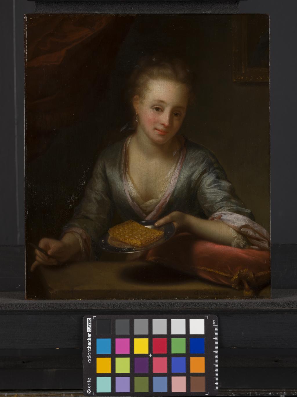 An image of A lady holding a plate. Schalcken, Godfried (Dutch, 1643-1706). Oil on panel, height 23.5 cm, width 20.5 cm, 1680-1690.