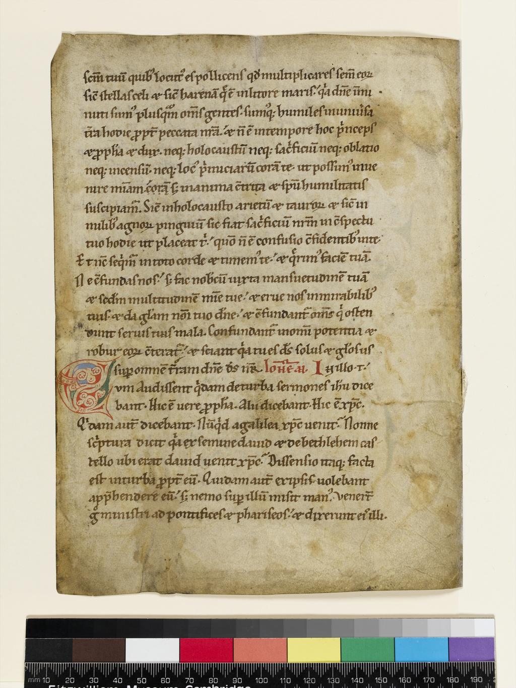 An image of Illuminated Manuscript. Leaf from a Lectionary. Excerpts from the Gospel of St John (7:40-53 and 11:47-49) and from Jeremiah 17:13-18. Gothic bookhand (textualis). Parchment, 237 x 173 (190 x 120) mm, 25 long lines, ruled in faint brown ink. Red arabesque initials [3 ll.] with floral or zoomorphic decoration on blue and green background; red penwork one-line initials. Parchment, gold, 1150-1200. Germany, Middle Rhine.